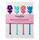 A set of plastic drink stirrers with a nub on the bottom to help you stir and a different type of flower on the top, each in a different color, for easy gripping. They are shown in the packaging. From left to right is a purple anemone, then a aqua rose, a pink daisy and last a blue tulip.
