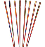 Eight multicolored bamboo chopsticks are lined up next to each other. They are mostly red, blue, green, and brown.