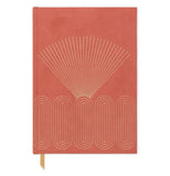 A red journal has gold foil fan and circular designs.