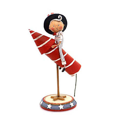This figurine is dressed in a white Uncle Sam outfit with a red, white, and blue hat and sits on a red and white striped rocket which is mounted on a star spangled stand.