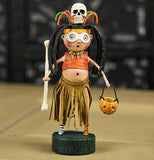 The Witch Doctor figure on the wooden table. 
