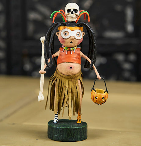 The Witch Doctor figure on the wooden table. 