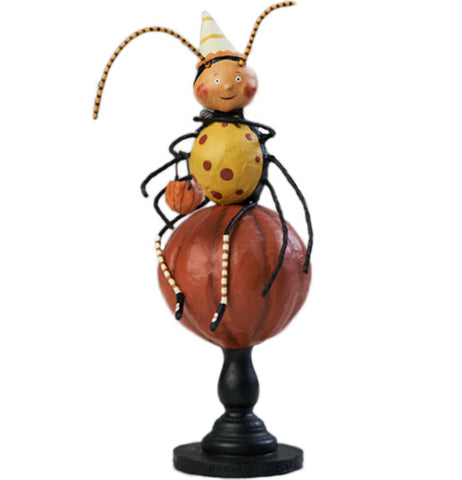 Alexa is a figurine in a Spider halloween costume. She's sitting on Pumpkin and holding a pumpkin trick or treat bucket.