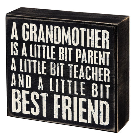 This black box sign has the words, "A Grandmother Is A Little Bit Parent A Little Bit Teacher And A Little Bit Best Friend" in white lettering.