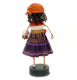 A back view of The Gypsy Rose figurine is shown. 