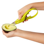 Person slicing up avocado pulp with the Avocado Tool.