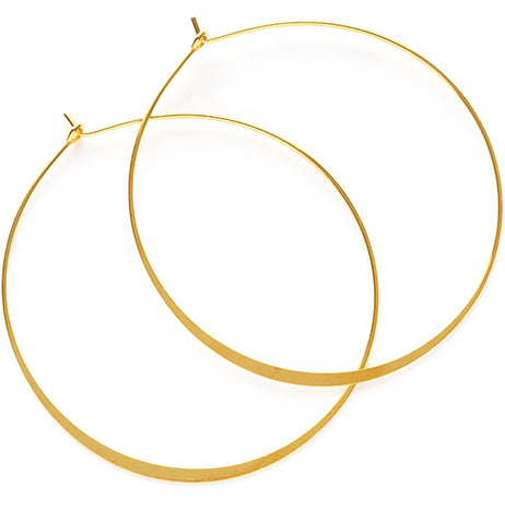 Two silver hoop earrings overlapping each other in a way that imitates a Venn diagram.