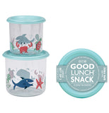 Two different sized clear plastic containers stacked on top of each other, the smaller on top. Each has a light blue lid and silhouettes of sea life such as sharks, starfish, octopus and crabs in red and different shades of blue. To the right is the top view of a container in the packaging. 
