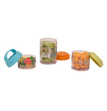 The three containers are sitting open. The smallest is a clear container that has banners of flags around it with gummy bears. the next container that shows llamas showing kiwi slices in the container. the last container is holding goldfish and has a triangular pattern.