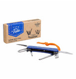 The "Marine" Multi-Tool unfolded laying next to the box it came in.