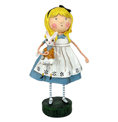 This figurine is of Alice from "Alice in Wonderland" holding the White Rabbit character in one of her hands.