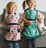 Apron Sally Cats Meow with the color of pink and green with cats on the apron.