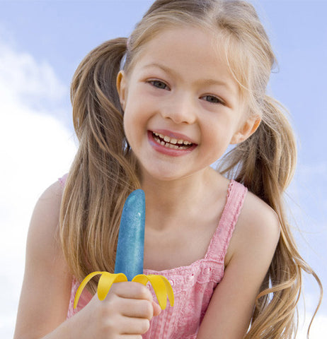 Girl enjoying the end results of the popsicle mold banana