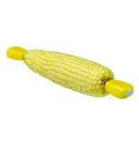 A piece of corn with corn holders on both sides