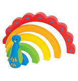 A rainbow peacock toy is facing the left corner. It's red, orange, green, and blue.