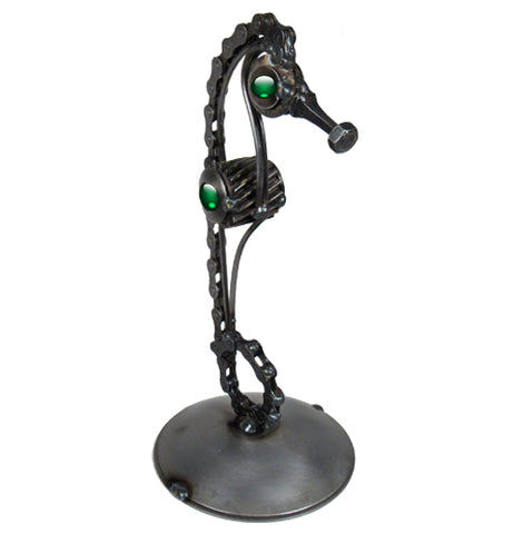 The black Seahorse made of metal looks at you. 