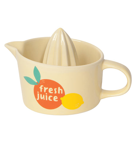 A citrus juicer shaped like a mug with the reamer cone in the center, a pour spout, and a picture of an orange and lemon on the side with the words "Fresh Juice" inside the orange