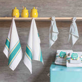The teal set of 4 dishtowels (two big ones that are white with teal large and small stripes along the top and bottom, and two small ones that are white with dashed stripes) hanging up that displays what it looks like to have them in your home.