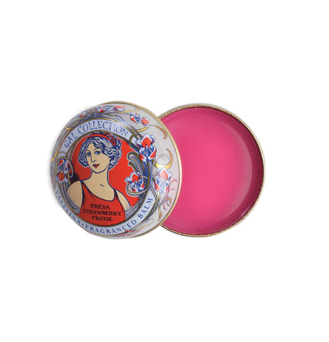 A circular red, blue, and gold art neaveau tin has pink lip balm in it.