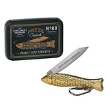 Gold fish shaped pocket knife connected to a silver mini carabiner with the black tin carrying case next to it.