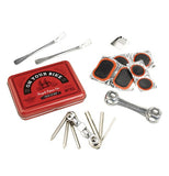 Bicycle repair kit with contents surrounding box.