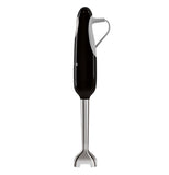 The side view of this black colored hand blender shows on the right he grey power cable, the base part is silver.