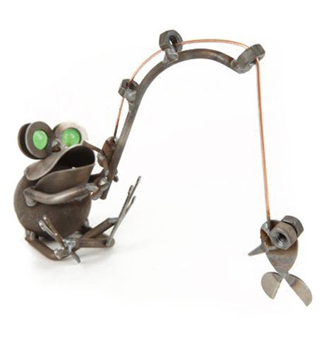 This metal sculpture is shaped like a frog with green marbles for eyes and catching a small fish on a fishing pole.