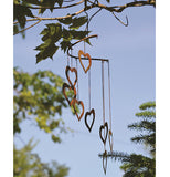 Hearts Spiral Mobile hanging from a tree branch.