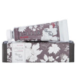 Hand creme, "In Love" Shea Butter, in a gray container with white flowers and package matches.