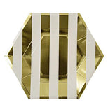 A gold and white stripped plate that is a hexagon shapped plate.