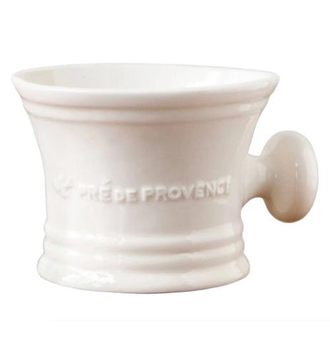 This hourglass-shaped cup has a circular handle and its logo, "Pre' De Provence" stenciled across its middle.