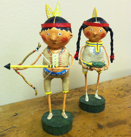 Native American Guide holding Bow and Arrow with Princess Holding a Basket of Corn