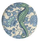 This dinner plate has a design of a dark green seahorse against a flowery oceanic background.