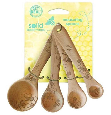 These beechwood spoons with pictures of bees and honeycombs on them are shown attached to their yellow packaging.