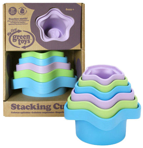 These are purple, green and blue star shaped stacking cups, each stacked from largest to smallest. One set is shown in its cardboard packaging in the background.