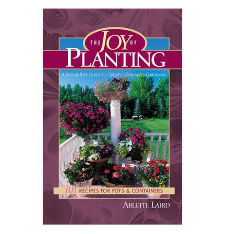 The purple book of the Joy of Planting has picture of colorful flowers in the garden area.
