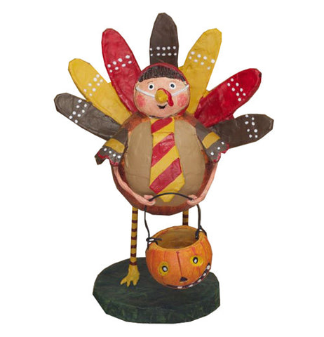 A boy dressed in a turkey outfit holding a jack-o-lantern bucket
