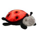 The ladybug toy is shown with the ability to light up and glow in the dark.