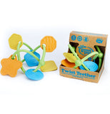 These are twisted plastic teethers with multi-colored shapes. One teether is shown on its own, while another is shown in its cardboard box packaging. At the bottom of the packaging are the words, "Twist Teether" in blue lettering.