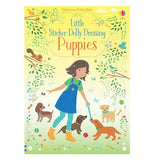 A book entitled "Little Sticker Dolly Dressing Puppies". The cover has a gradient that starts yellow and fades into green. A girl in a overall dress, green t-shirt, blue polka-dotted leggings, and orange boots plays tug-of-war with a brown puppy. Three other puppies stand around her.