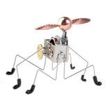 This six legged wind-up Pintacuda robot toy has a motor and a gold propeller that when turned on it moves all around and the propeller turns.