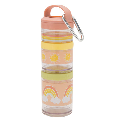Multiple, plastic stackable snack containers are pastel pink, yellow, green, and transparent in color. A steel carabiner hangs off a small handle. The snack containers are stacked together. They appear to be empty.