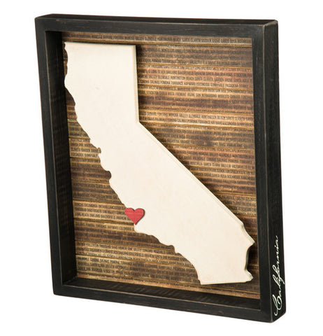A box sign with a 3D cutout of California with a little red heart.