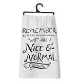 A cotton dish towel with black text on it. Any "nice and normal" family would like to have this dishtowel.
