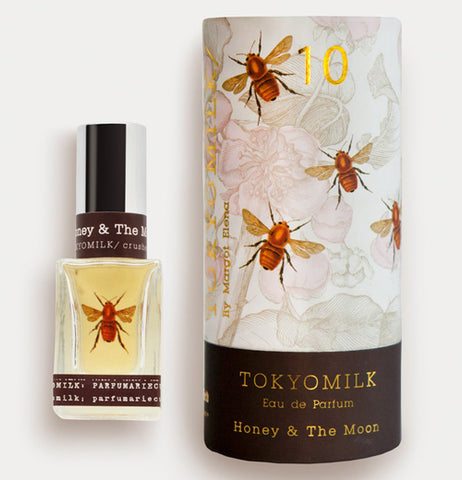 this perfume is alongside the box that says honey and the moon on it and is decorated with bees