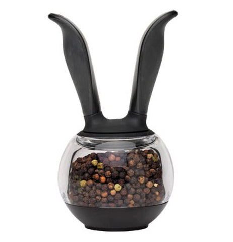 This Pepper ball grinder has a black rubber bottom piece. The container is clear and it shows pepper inside. Ergonomic handles make grinding fresh pepper easy.