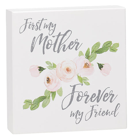 White box sign that says "First My Mother Forever My Friend."  It has pink roses in the middle of it.