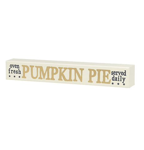 A white wooden sign with the phrases "Oven Fresh" "Pumpkin Pie" and "Served Daily"