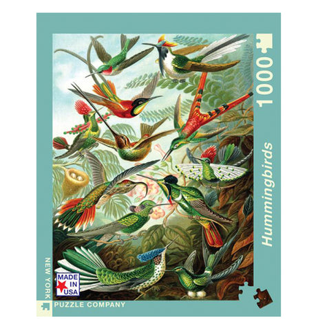 Centered view of "Hummingbirds" puzzle with different types of hummingbirds fluttering and sitting among fern leaves.