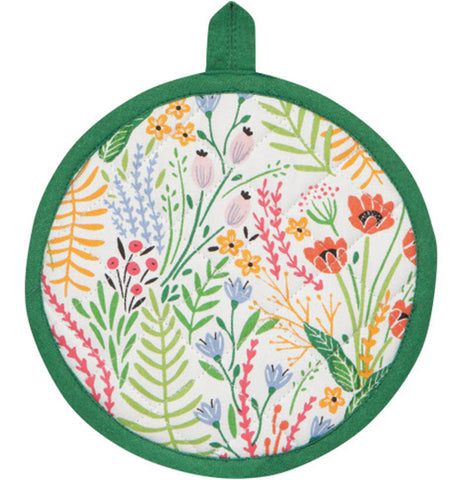A circular white potholder with a green border and multi-color (red, yellow, black, blue, gray) floral/plant design.